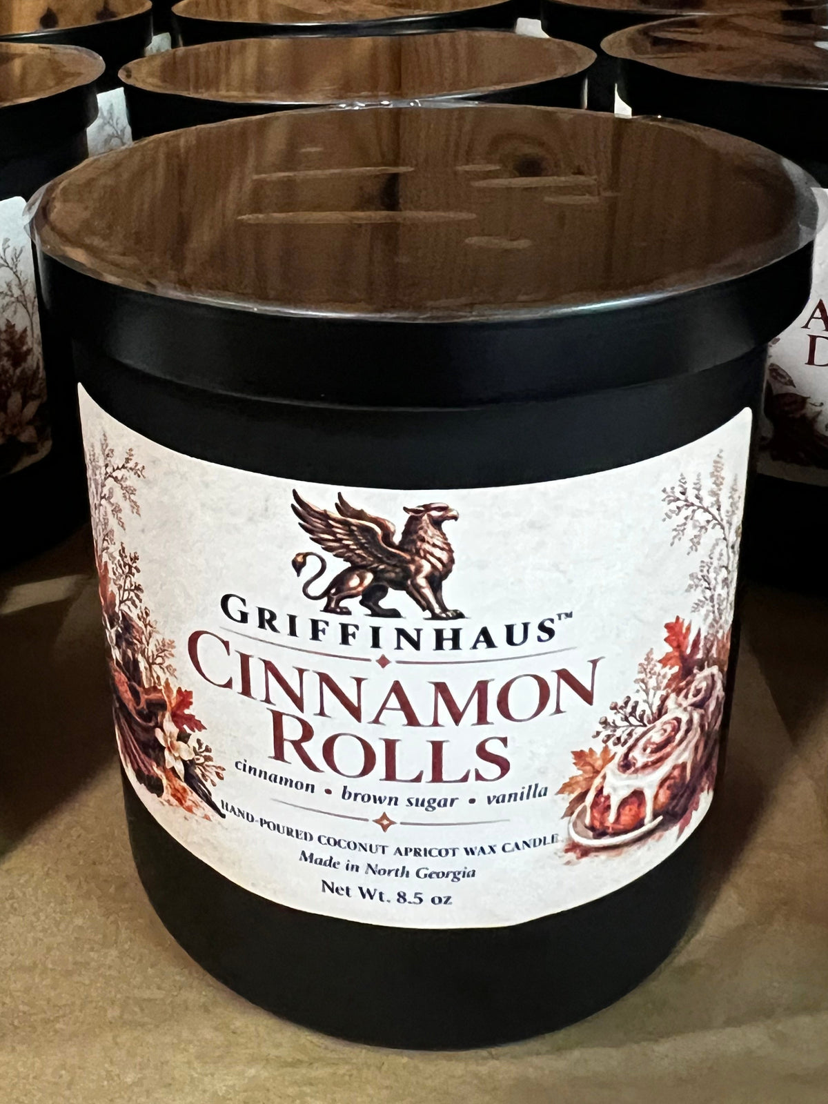 GriffinHaus Cinnamon Rolls 8.5 oz hand-poured apricot coconut wax candle in a black jar with wooden lid