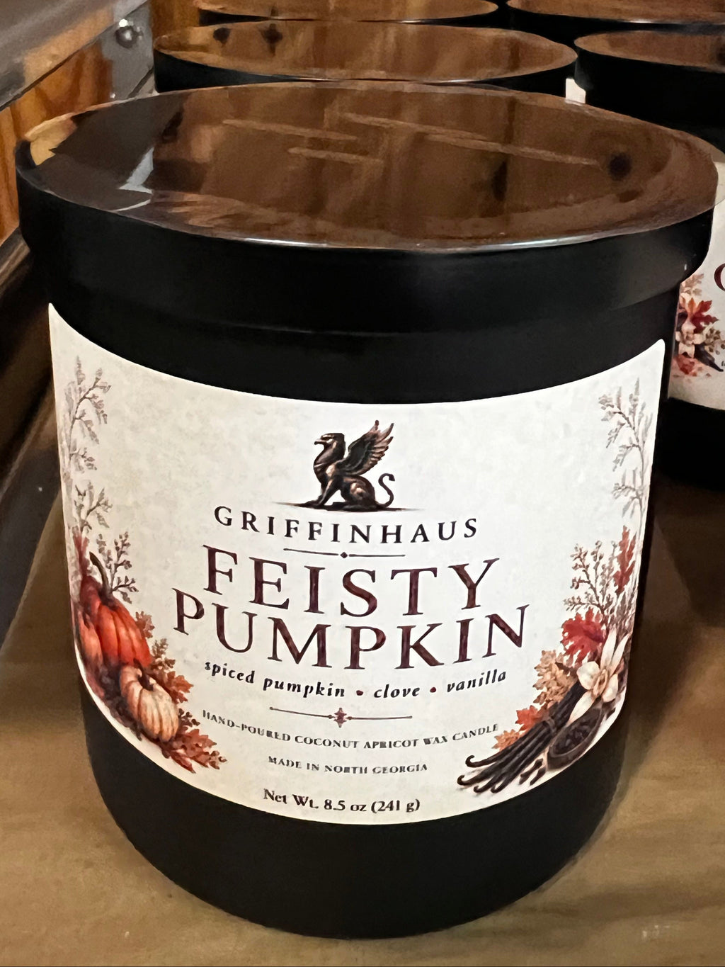GriffinHaus Feisty Pumpkin 8.5 oz hand-poured apricot coconut wax candle in a black jar